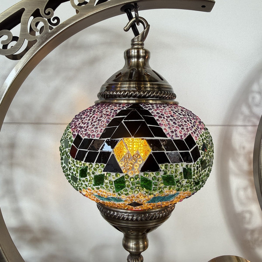 Halloween witch mosaic globe lamp with a black glass pointed hat and gold buckle, hung in a crescent moon frame