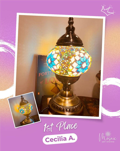 Colorful mosaic glass table lamp with blue and white patterns awarded 1st place to Cecilia A.