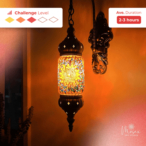 Ornate mosaic hanging lamp glowing warmly on an orange wall with 2-3 hour challenge level indicator