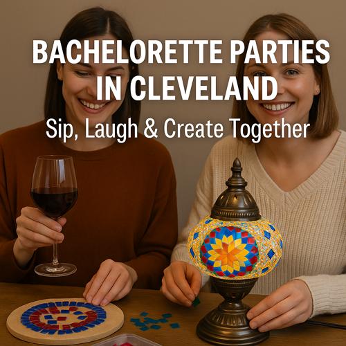Two women smiling and making mosaic art while enjoying wine at a bachelorette party in Cleveland