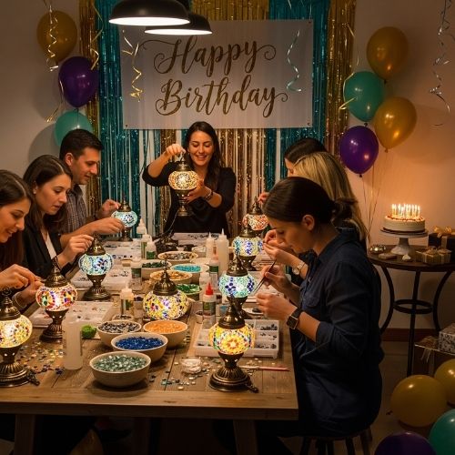 Group painting mosaic lamps at birthday party with Happy Birthday banner and colorful balloons