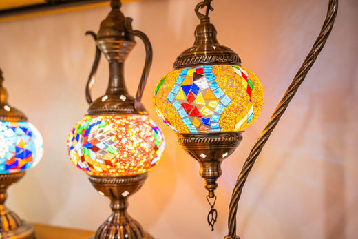 Colorful mosaic glass Turkish table lamps with brass details glowing warmly