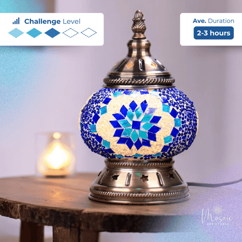 Blue and white mosaic table lamp with brass base on wooden table, average 2-3 hour craft challenge