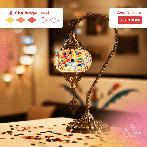 Colorful mosaic lamp with brass stand on a table, warm indoor lighting, mosaic craft project