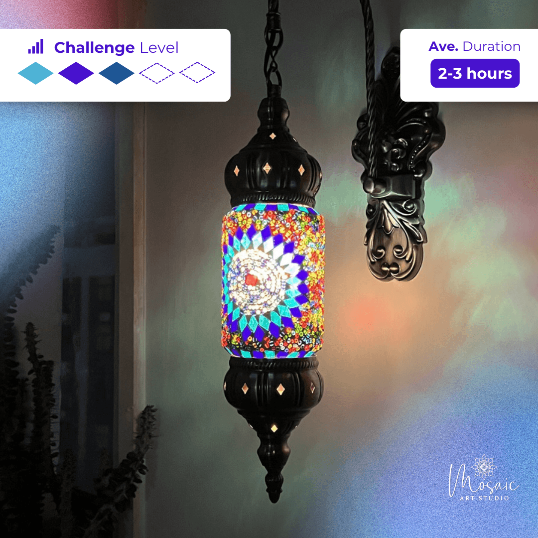 Colorful mosaic hanging lamp with intricate glass pattern and ornate black metal fixture