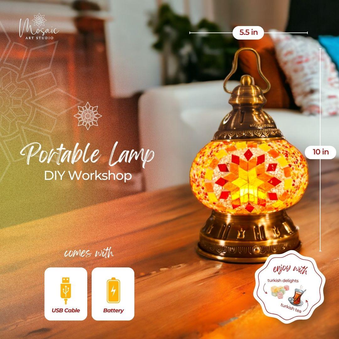 Decorative portable mosaic lamp on wooden table with USB cable and battery