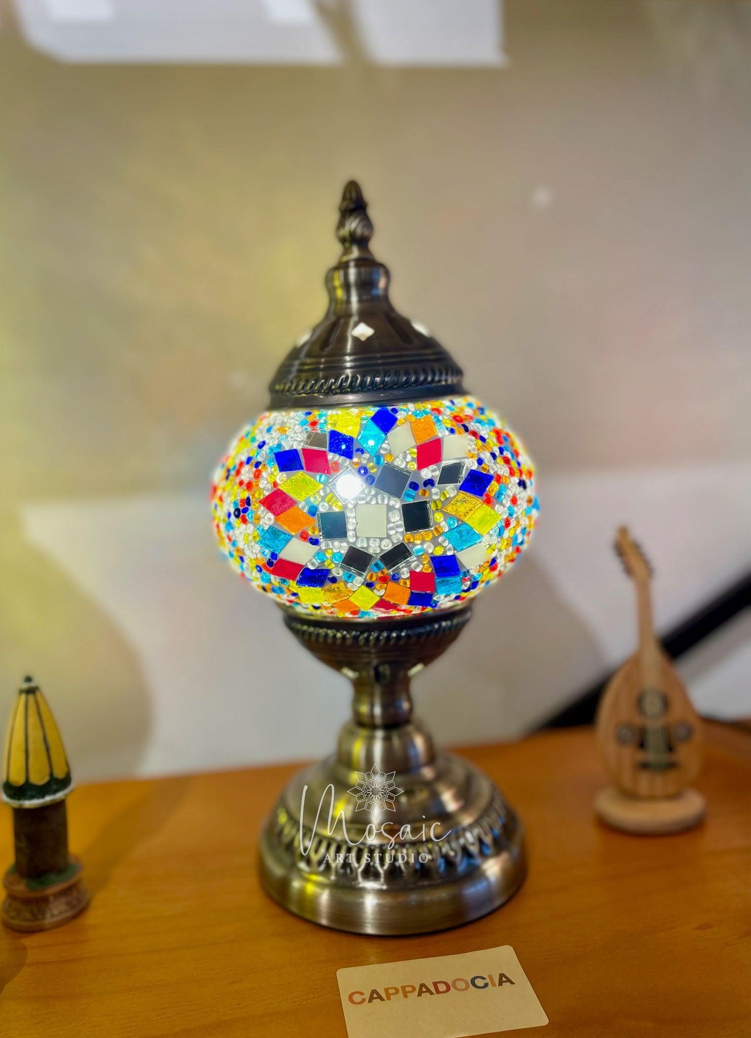 Turkish mosaic lamp with colorful star pattern on wooden surface, Cappadocia decor