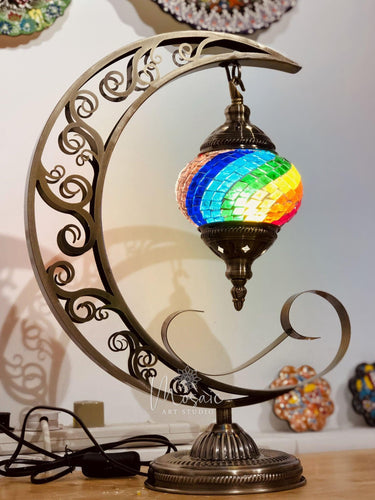 Colorful Turkish mosaic lamp with rainbow glass hanging on ornate crescent stand