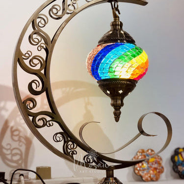 Colorful Turkish mosaic lamp with rainbow glass hanging on ornate crescent stand