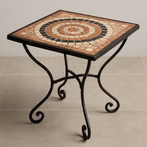 Square mosaic table with terracotta and black circular tile pattern and black wrought iron legs