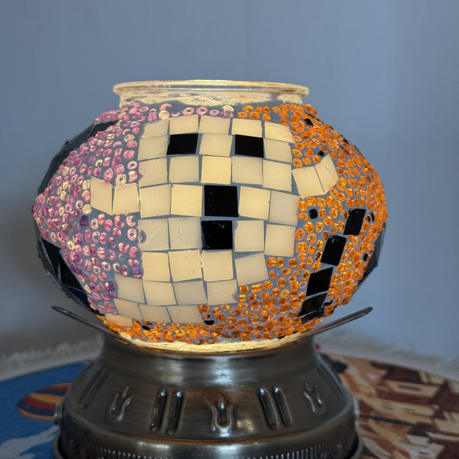 Handmade Halloween ghost mosaic globe lamp glowing with a cream glass ghost on pink and orange beads