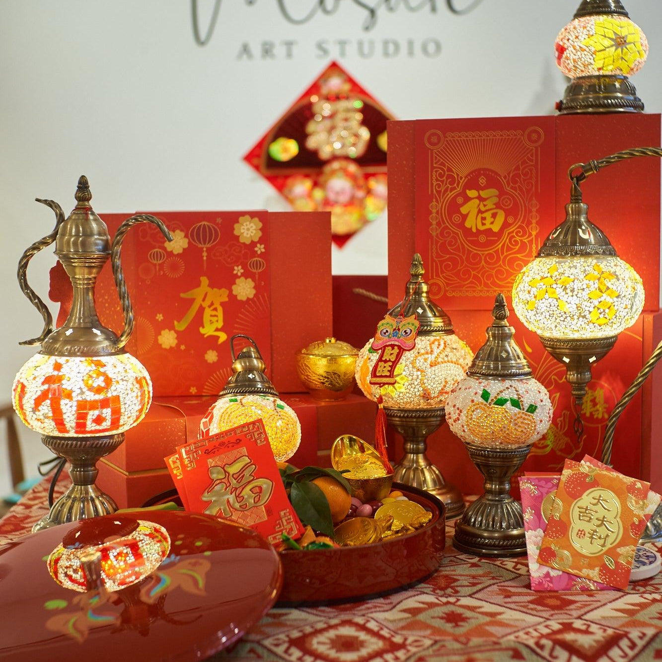 Turkish mosaic lamps and red envelopes displayed on patterned tablecloth for Chinese New Year celebration