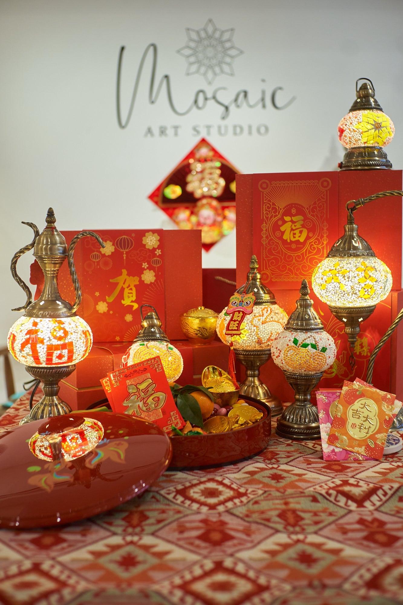 Turkish mosaic lamps and red envelopes displayed on patterned tablecloth for Chinese New Year celebration