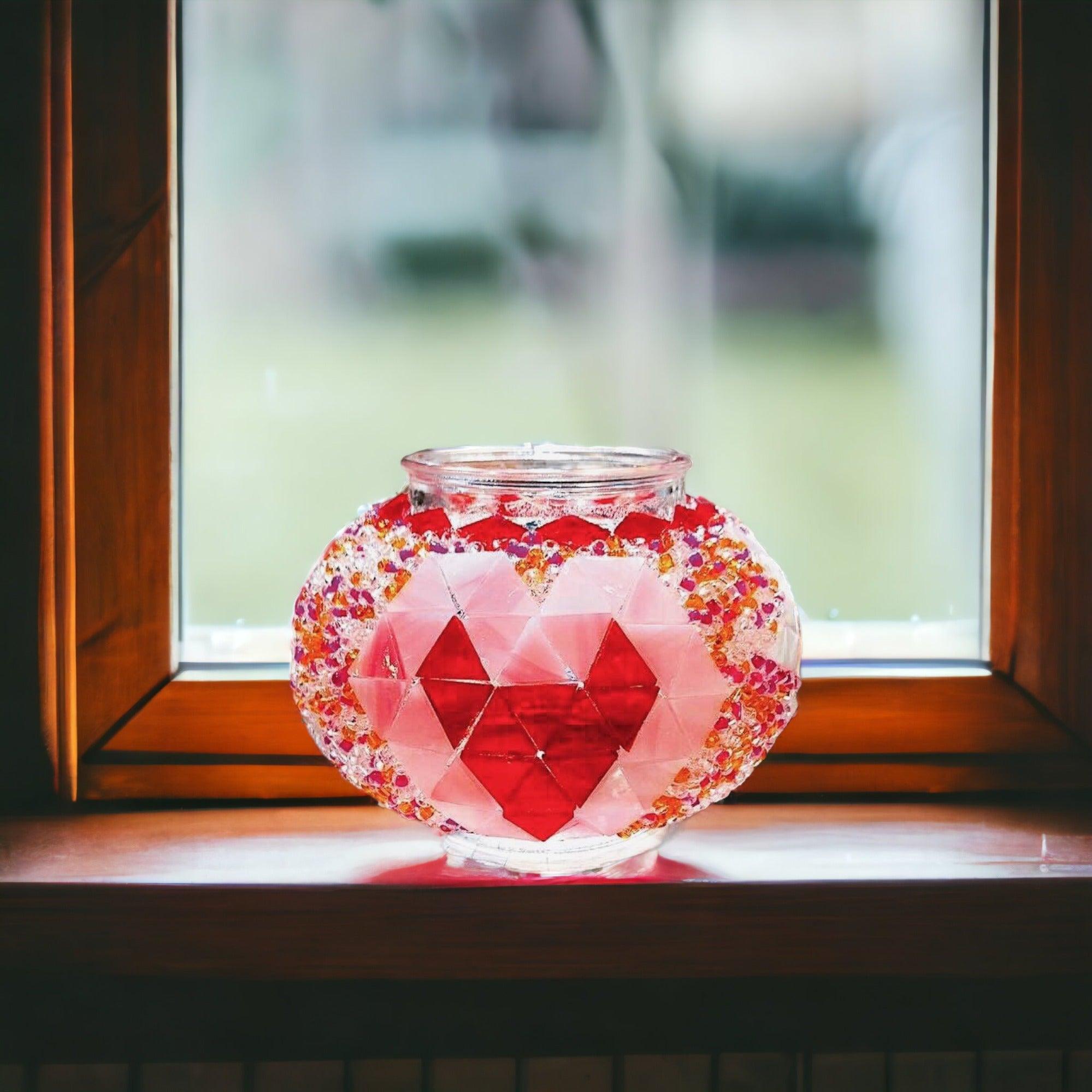 Turkish mosaic lamp with red heart pattern, placed on a wooden windowsill