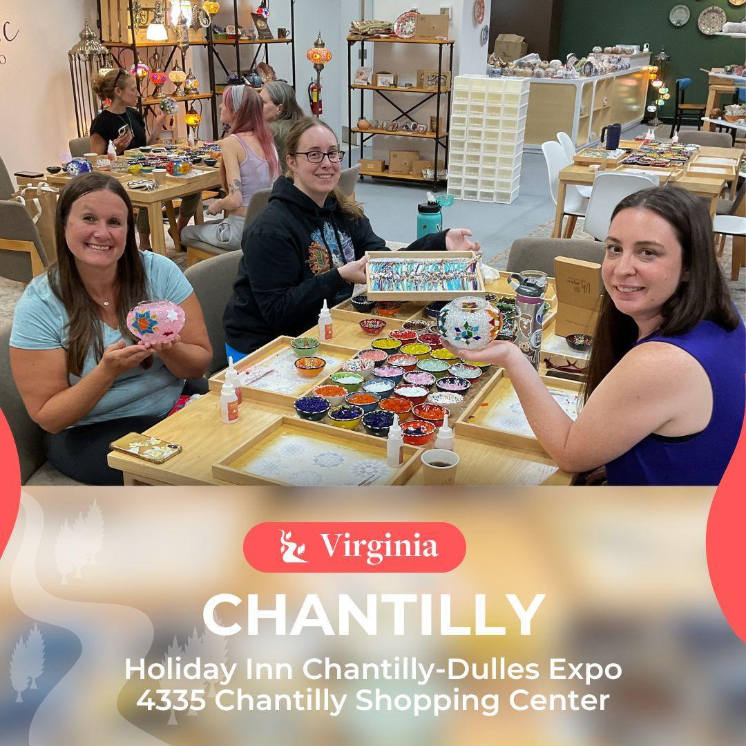 Three women crafting with colorful beads and mosaic supplies at Chantilly art workshop in Virginia