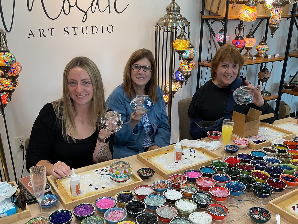 Three women smiling with their mosaic lamps at Mosaic Art Studio in Voorhees, NJ