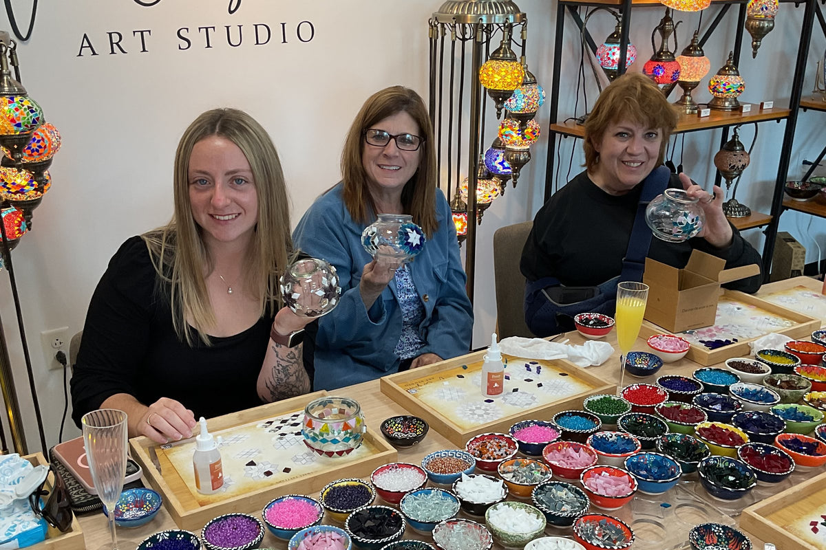Mothers, daughters and friends making mosaic lamps together at Mosaic Art Studio in Voorhees, NJ