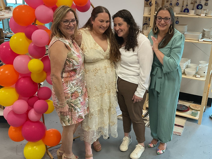 A bridal party by the balloon arch at a private event at Mosaic Art Studio Voorhees