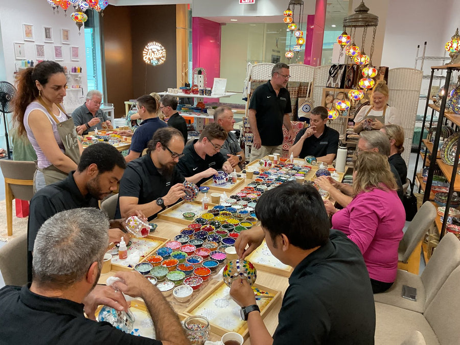 Colleagues choosing mosaic glass at a team event in Voorhees, NJ