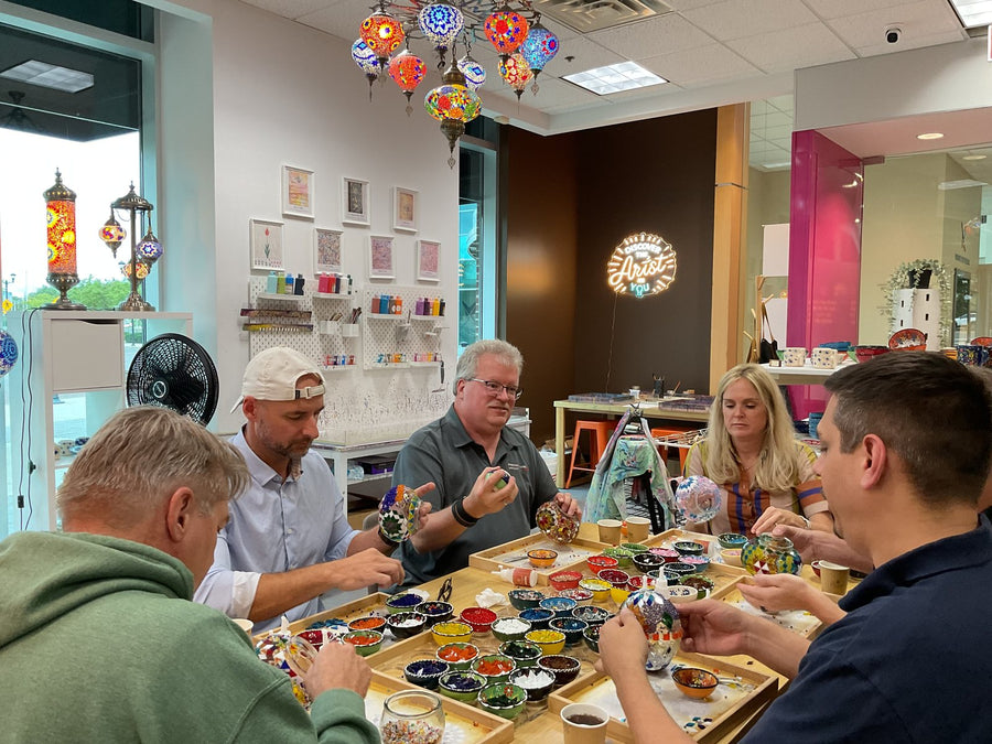 Team members working on their mosaic lamps at the Voorhees, NJ studio