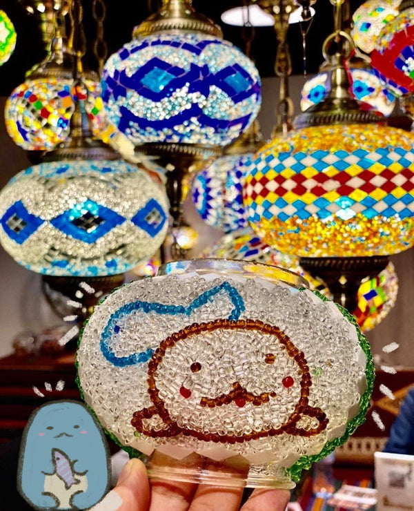 A cartoon friend in brown and silver beads. Handmade with love at a Mosaic Art Studio workshop.