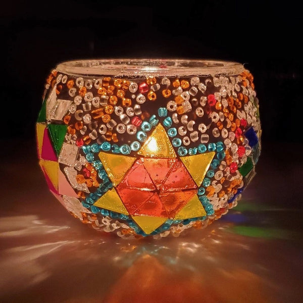 Amber star outlined in teal. Handmade with love at a Mosaic Art Studio workshop.