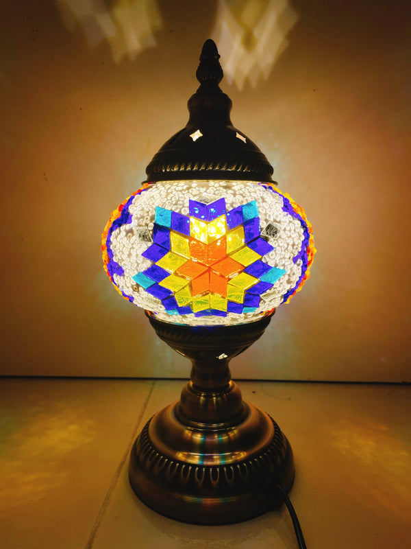 Orange star on a cobalt burst. Handmade with love at a Mosaic Art Studio workshop.