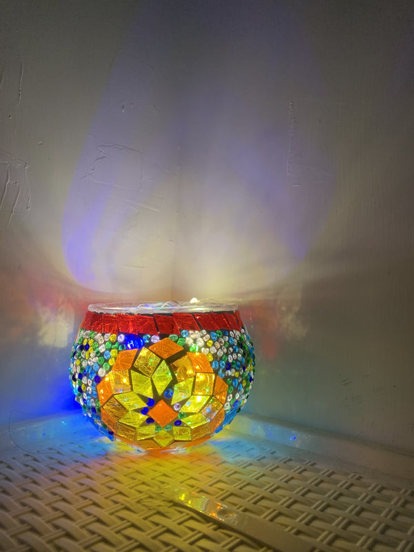 Rainbow diamonds under a red rim. Handmade with love at a Mosaic Art Studio workshop.