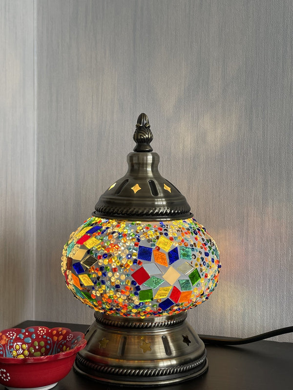 Rainbow stars on a beaded ground. Handmade with love at a Mosaic Art Studio workshop.