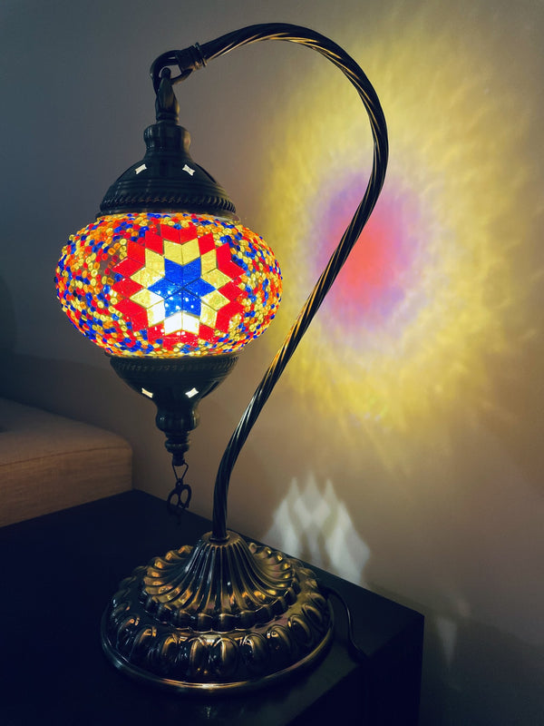 Red star on a rainbow ground. Handmade with love at a Mosaic Art Studio workshop.