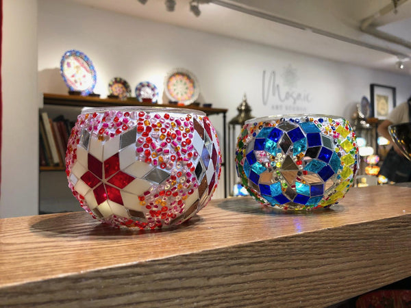 Red star on pink, and a cobalt flower. Handmade with love at a Mosaic Art Studio workshop.