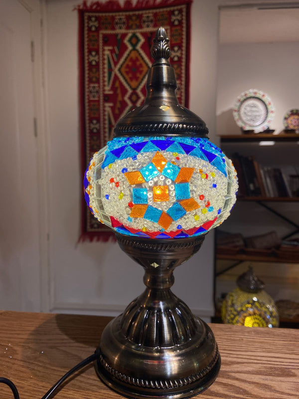 Turquoise flower on orange beads. Handmade with love at a Mosaic Art Studio workshop.