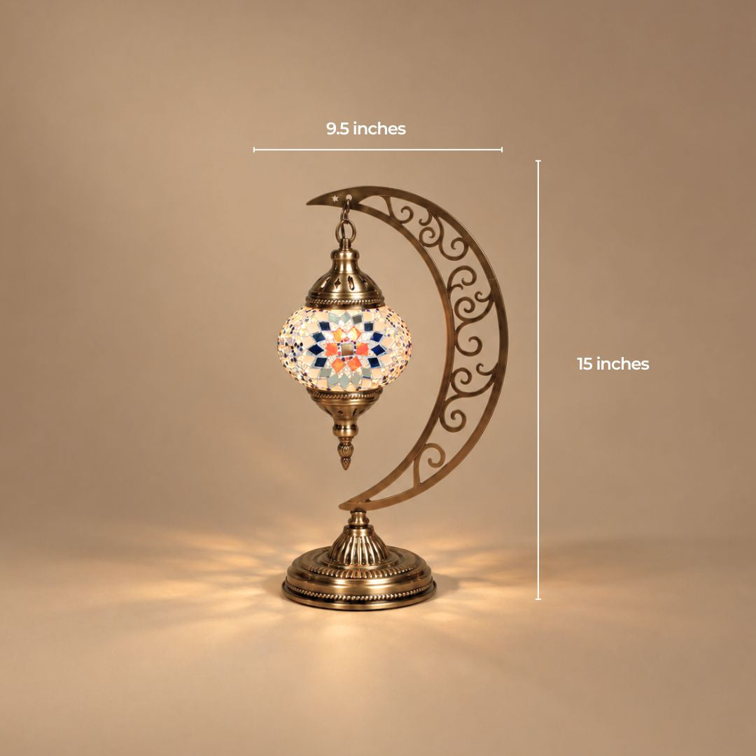 Mini Turkish mosaic moon lamp with the globe hanging from a filigree crescent, 9.5 by 15 inches