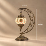 Mini Turkish mosaic moon lamp with the globe hanging from the tip of a filigree crescent, 9.5 by 15 inches