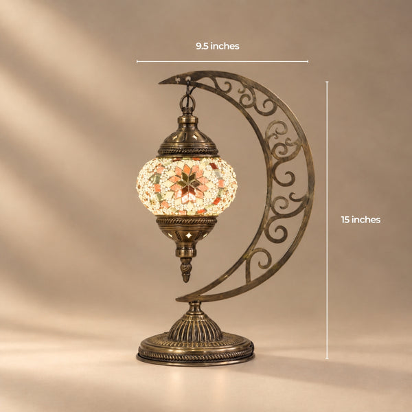 Mini Turkish mosaic moon lamp with the globe hanging from the tip of a filigree crescent, 9.5 by 15 inches