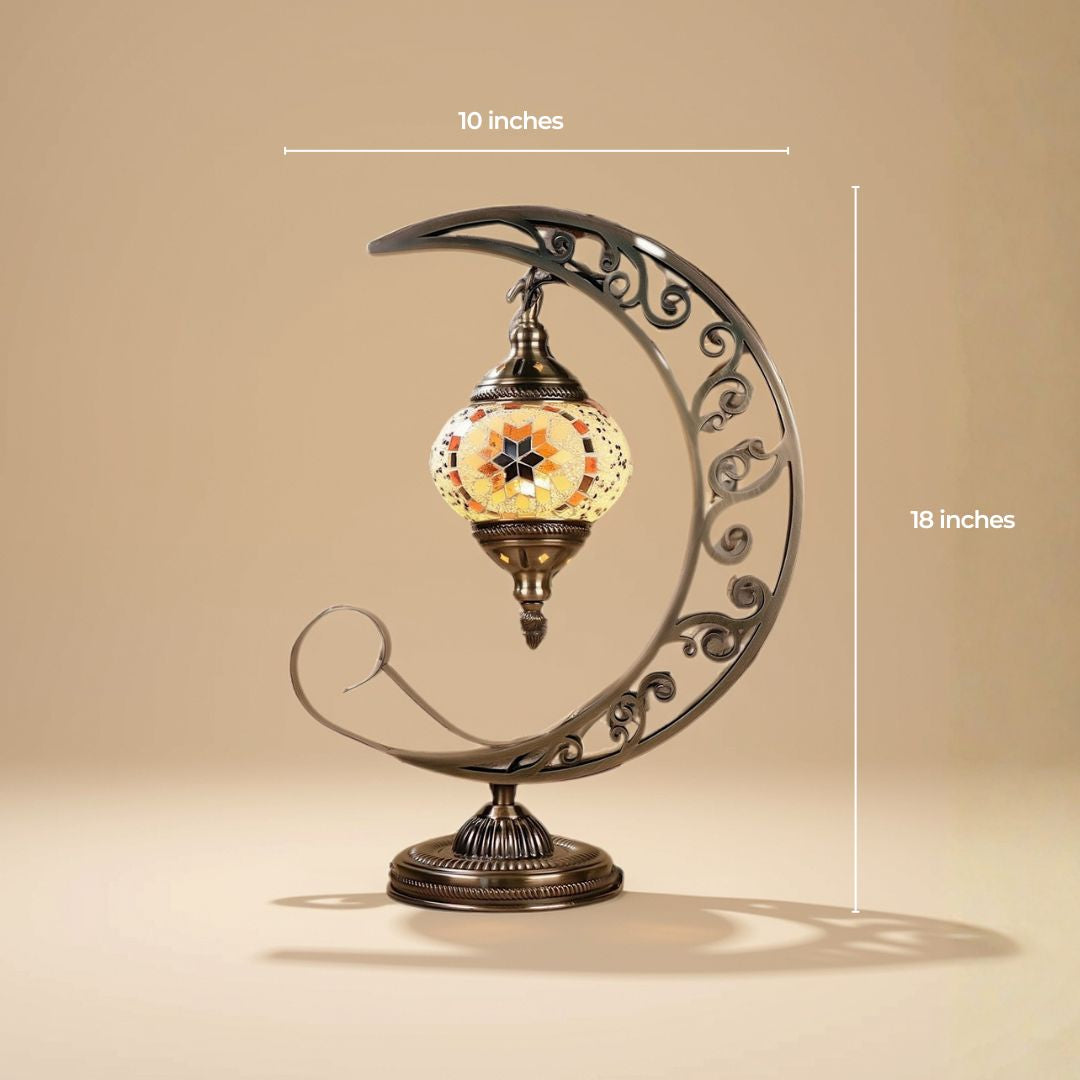 Turkish mosaic moon lamp with the globe suspended inside a scrolled crescent stand, 10 by 18 inches