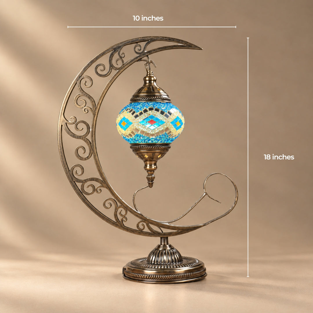 Turkish mosaic moon lamp with the globe suspended inside a scrolled crescent stand, 10 by 18 inches