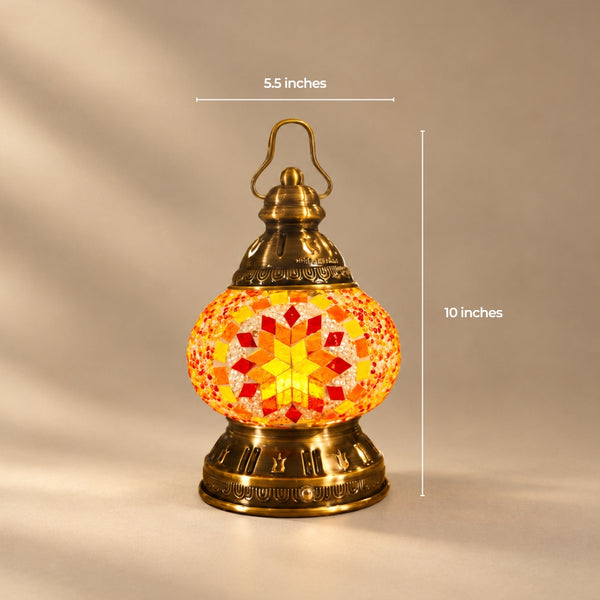Portable Turkish mosaic lamp in red and orange with a carry handle over a domed cap, 5.5 by 10 inches