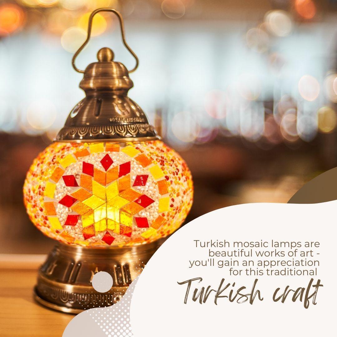 Close-up of a colorful Turkish mosaic lamp with warm yellow, orange, and red glass pieces in a brass holder