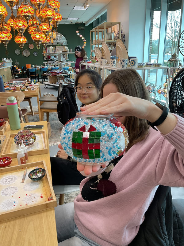 Guests making mosaic lamps at Mosaic Art Studio