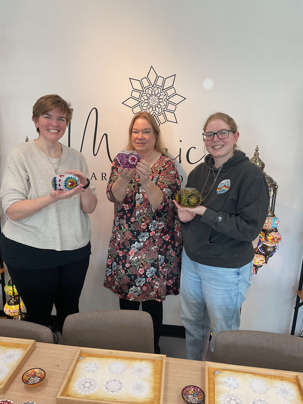 Guests making mosaic lamps at Mosaic Art Studio
