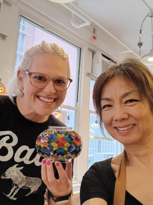 Guests making mosaic lamps at Mosaic Art Studio