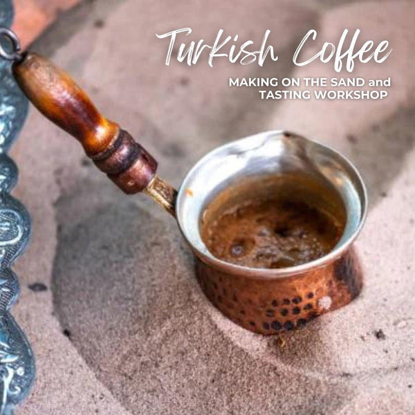 Turkish coffee brewing in copper cezve on hot sand during coffee making workshop