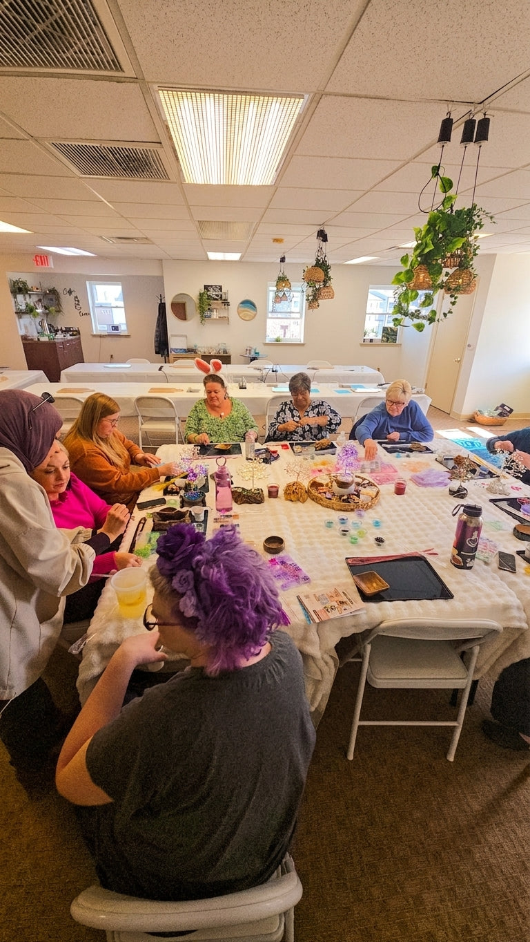 Group of participants crafting wire trees together during a workshop session in King of Prussia, PA