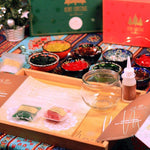 DIY Christmas mosaic candle holder kit with colorful tiles, glass holder, glue, and instructions