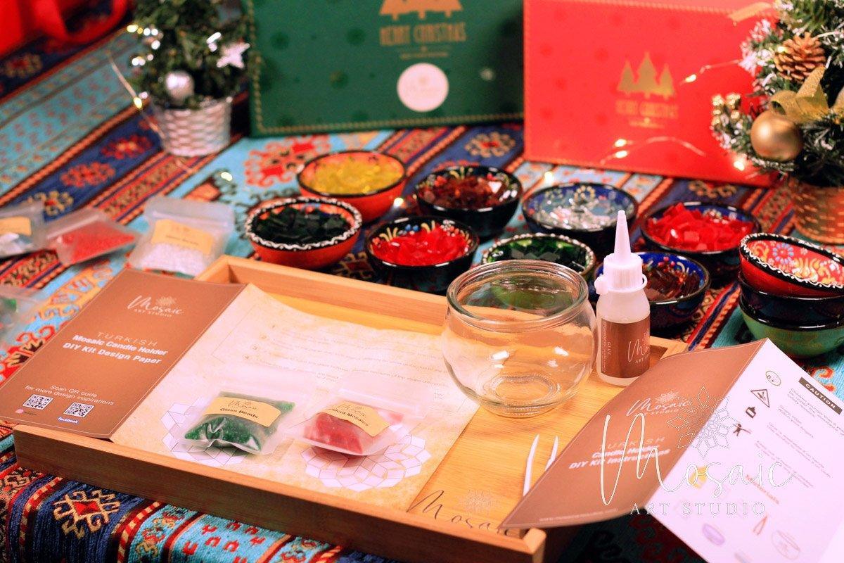 DIY Christmas mosaic candle holder kit with colorful tiles, glass holder, glue, and instructions